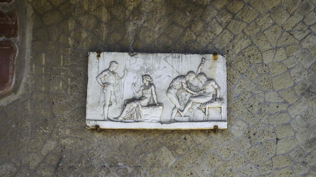 Ins. Orientalis I, 2, Herculaneum, August 2021. 
Plaque now on south wall of atrium, originally from one of the rear rooms. Photo courtesy of Robert Hanson.
